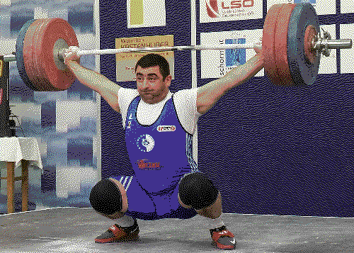 Weightlifter receiving a snatch in a deep overhead squat